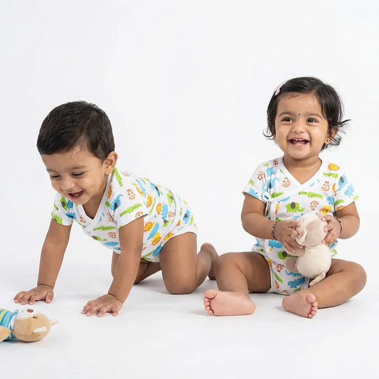 Baby onesie and footed pajamas set - Unicorn and dinosaur print.