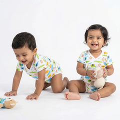 Baby onesie and footed pajamas set - Unicorn and dinosaur print.