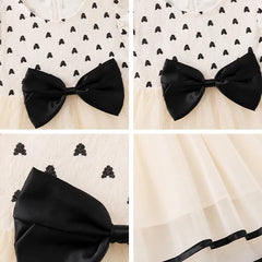 Adorable Black Bow Dress with Ruffle Hem - Baby Girls' Fashionable Outfit