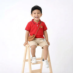 Chic Toddler Outfit: Red Polo Shirt and Beige Shorts with White Stripes